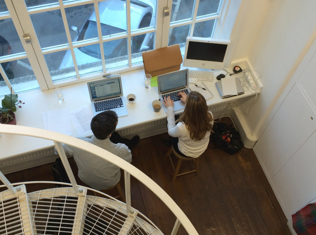 C & J Working by window