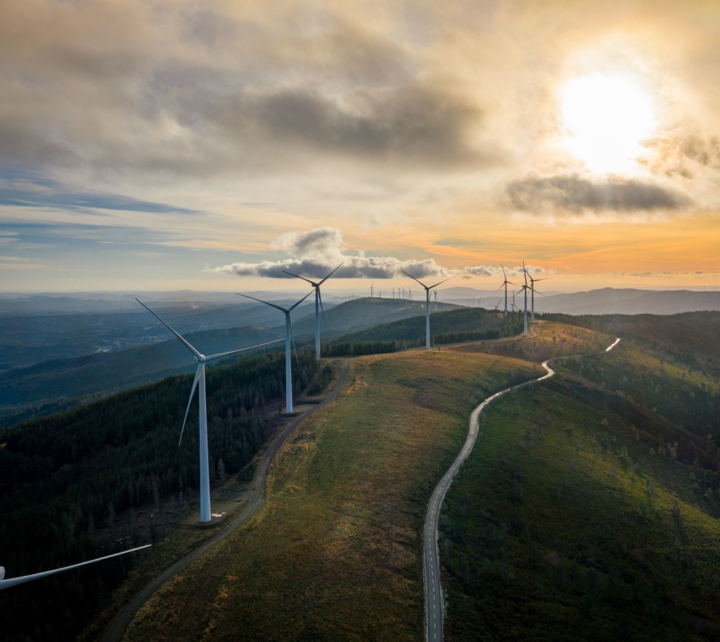 wind turbines on top of a hill