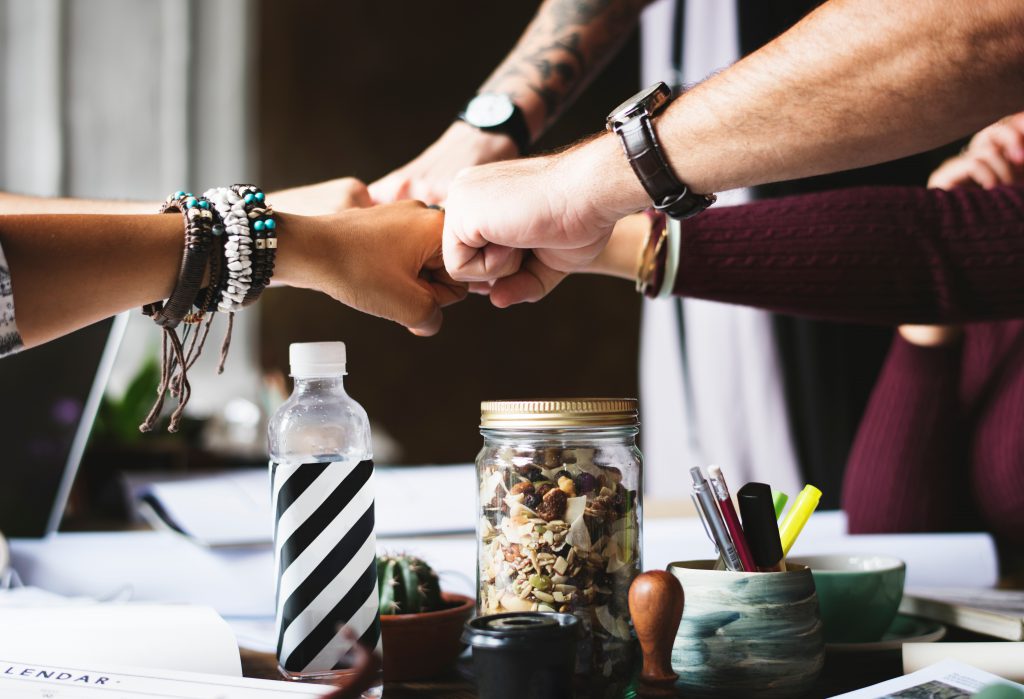 Fist bumps between participants